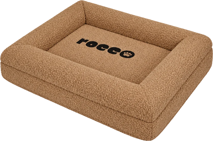 The Bolster Bed in caramel boucle